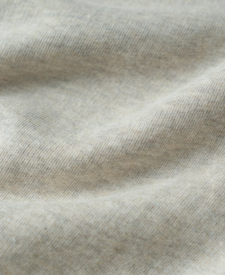 Apricot Gray sweatshirt knit fabric close-up with soft heather texture