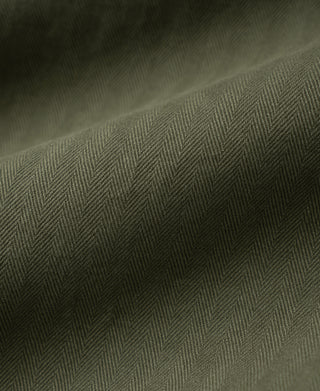Olive herringbone fabric deck pants with textured diagonal weave.