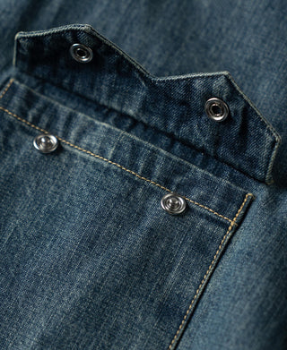 Washed denim shirt collar detail with snap-button placket and contrast topstitching