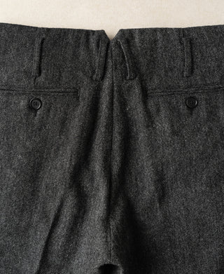 High-waisted wool trousers in gray, button front and pleated waistband