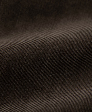Coffee brown corduroy fabric texture close-up