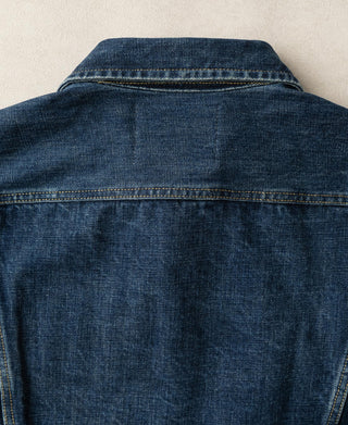 Indigo denim rider jacket back view with yoke seam and contrast yellow topstitching
