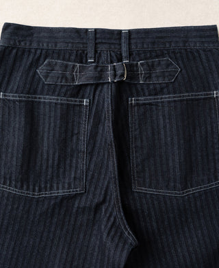 Indigo denim fatigue pants front with buckle-back waistband and two large cargo pockets