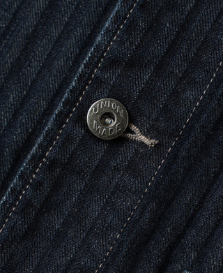 Indigo denim jacket 'Union Made' button over herringbone texture