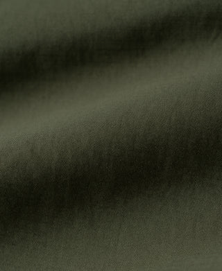 Olive cotton fabric texture with fine weave surface