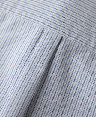 Light blue striped oxford shirt placket seam with contrast stitching