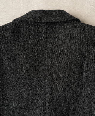 Back view of gray wool suit jacket with center seam