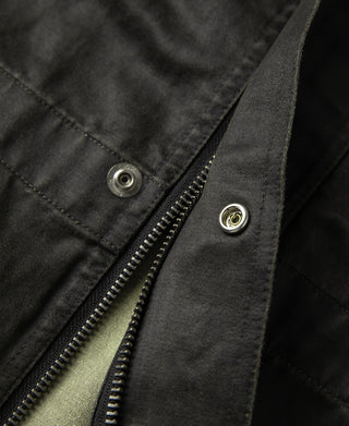 Black olive field jacket zipper edge with metal snap buttons on placket