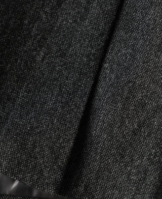 Gray wool suit jacket close-up of shoulder and collar fabric