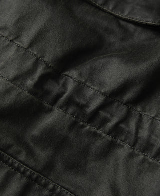 Black olive field jacket fabric with stitched seams and panel quilting