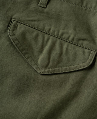 Olive cargo pants close-up of rounded back pocket with stitched edge