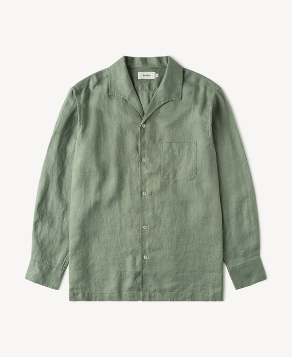 Sage green linen button-front shirt with pointed collar and long sleeves