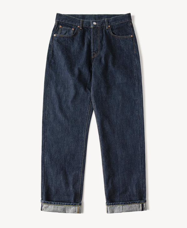 Indigo selvedge denim jeans with straight legs, button fly, and cuffed hem