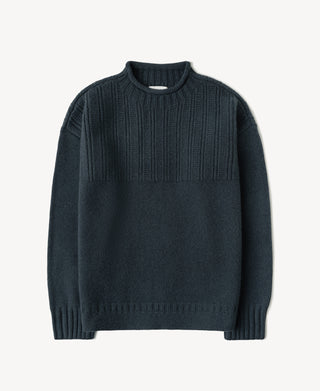 Dark blue wool sweater with mock neck, textured chest panels, and ribbed cuffs and hem