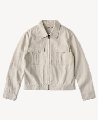 Natural twill Eisenhower jacket with stand collar, front zipper, and chest flap pockets