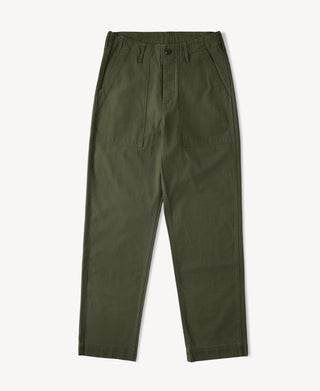 Olive fatigue pants with drawstring waistband, button fly, and tapered leg