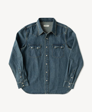 Washed denim western shirt with pointed yoke, button-front placket, and chest flap pockets