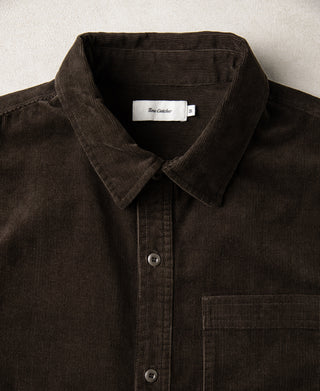 Brown corduroy work shirt collar and button placket with chest pocket detail