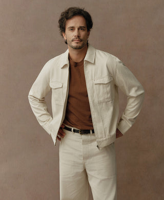 Natural twill jacket worn open, showing its zipper front and two flap chest pockets