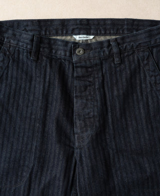 Indigo herringbone denim work pants waistband with button closure and belt loops