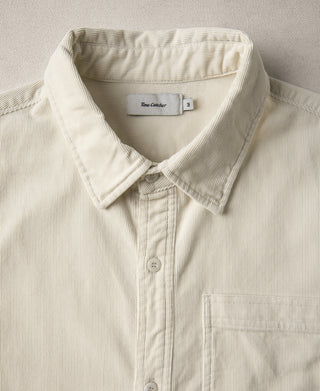 White corduroy work shirt with button-front, pointed collar, chest pocket