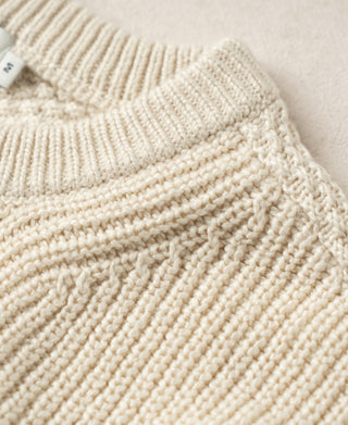 Natural cotton sweater neckline and textured seed-stitch shoulder detail