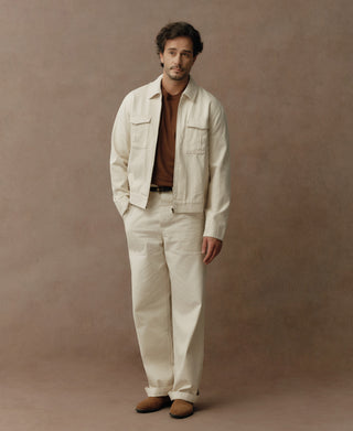 White herringbone deck pants with a straight-leg fit and cuffed hems.