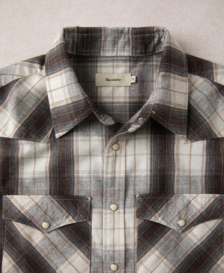 Beige and dark plaid western shirt with spread collar and snap front