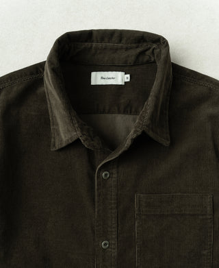 Dark green corduroy work shirt collar with button placket and chest pocket