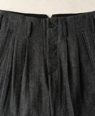 Pleated waistband detail with black button and center front crease