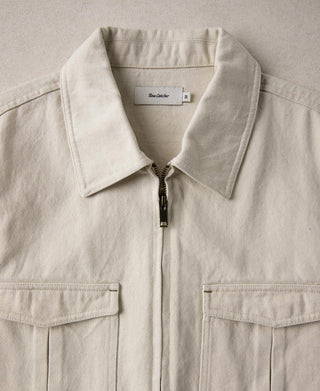 Natural twill Eisenhower jacket collar with front zipper and two chest flap pockets