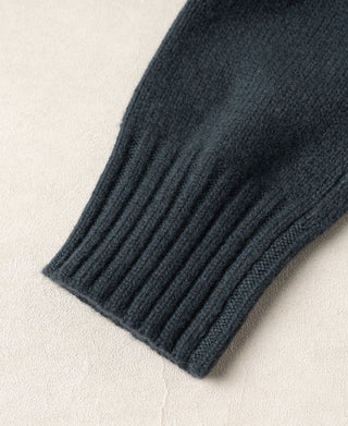 Dark blue wool sweater sleeve with a wide ribbed cuff
