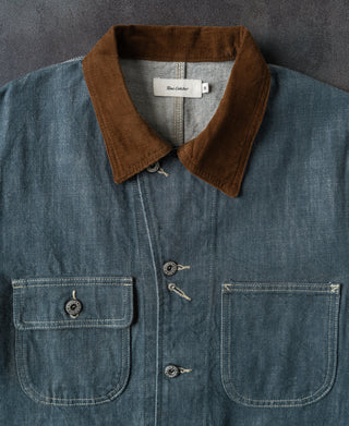 Sage blue denim barn jacket front view with brown corduroy collar and flap chest pockets