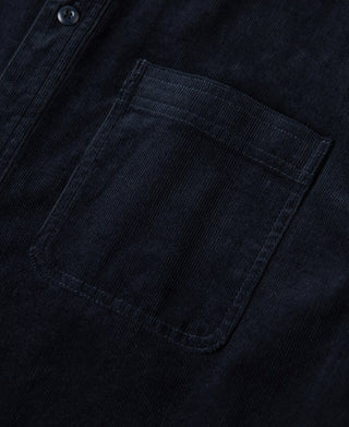Indigo corduroy shirt chest pocket with stitched border and button placket