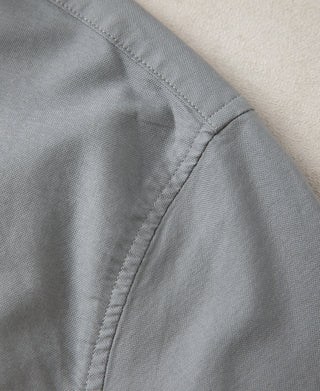 Close-up of gray oxford fabric texture with stitched seam