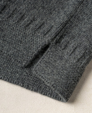 Gray wool sweater hem with textured knit and ribbed edge