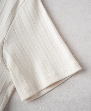 Oatmeal ribbed cotton T-shirt fabric close-up with vertical texture stripes