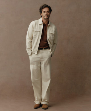 White herringbone deck pants with a straight leg and cuffed hems, shown with a jacket.