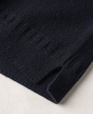 Navy wool sweater hem with textured knit and side slit