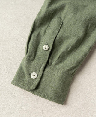 Sage green work shirt sleeve cuff with two-button placket detail.