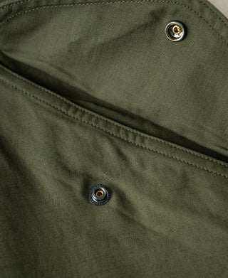 Olive cargo pants waistband with button fly and contrast seam stitching