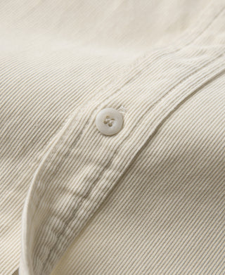 White corduroy shirt placket with two visible buttons