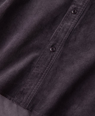 Purple corduroy shirt front with button placket and two visible dark buttons