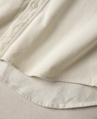 White corduroy sleeve cuff with pleated hem detail