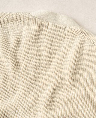 Back of the natural cotton cardigan showing its ribbed knit and shoulder seam