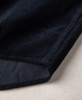 Indigo corduroy shirt cuff and hem with stitched edge and fabric texture
