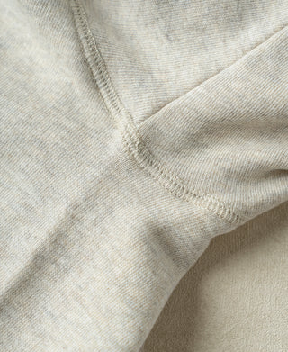 Apricot Gray double-V neckline seam close-up with stitched rib trim