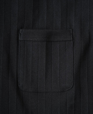 Close-up of vintage black chest pocket on ribbed cotton T-shirt.