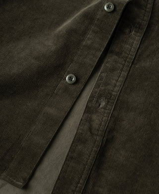 Dark green corduroy shirt front with button placket and chest pocket