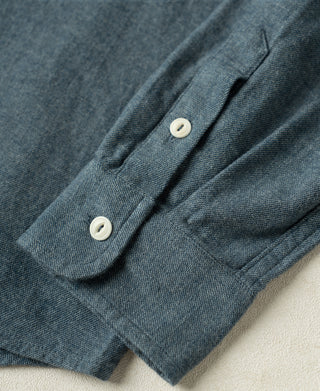 Royal blue flannel work shirt cuff with two buttons and rolled sleeve edge